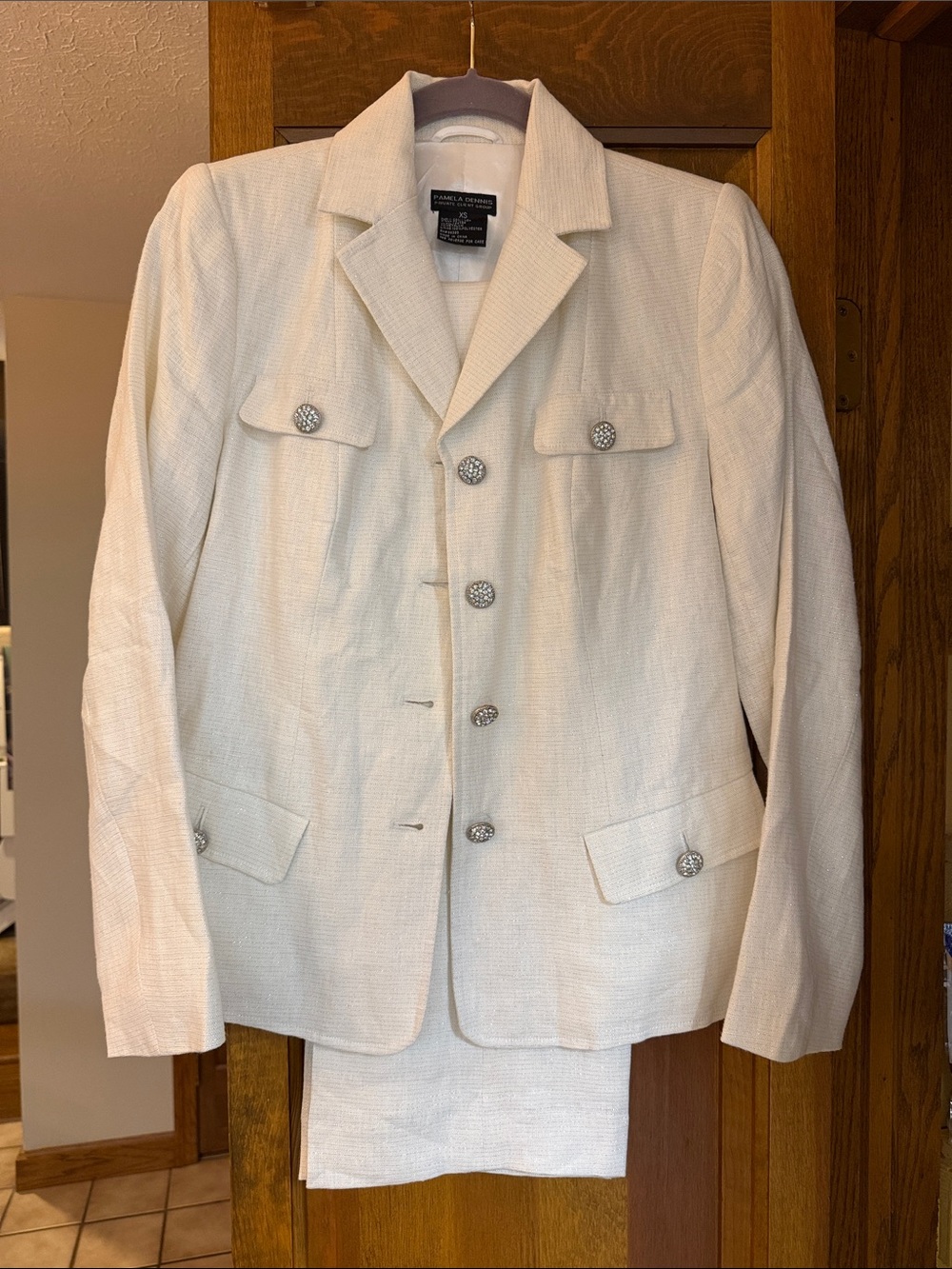 Pamela Dennis Cream Textured women’s suit with decorative buttons.